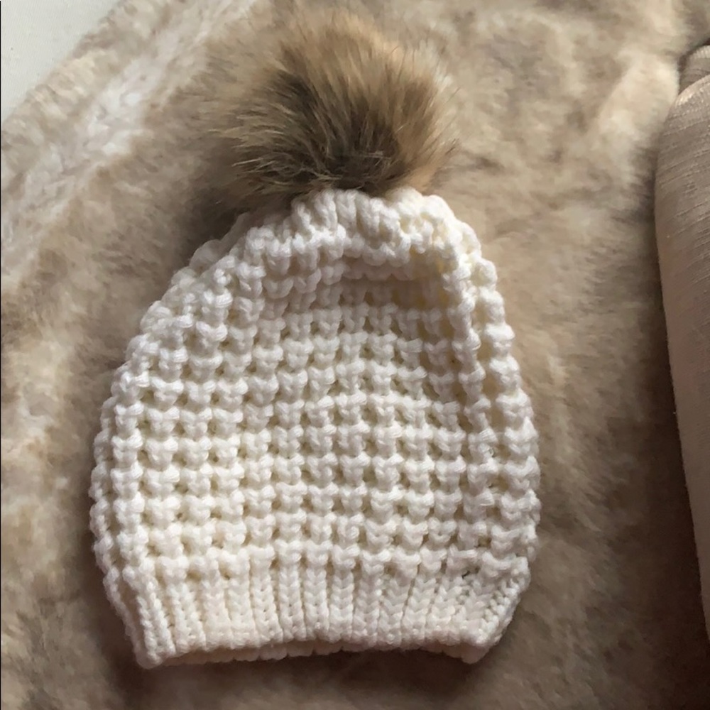 Cream beanie with faux fur pom pom